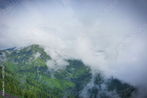 Fog on Mount 'Seven' . A cool and moody morning on the top of the world. © Redfisherstudio