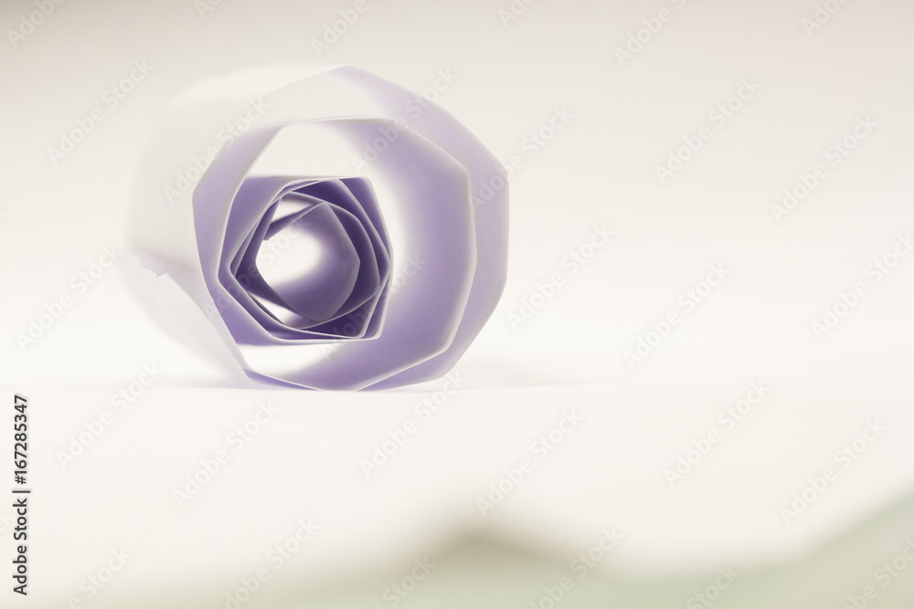 Colorful paper shapes with paper background
