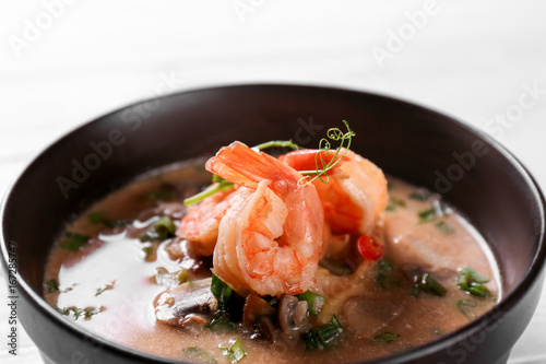 Delicious soup with shrimps in bowl