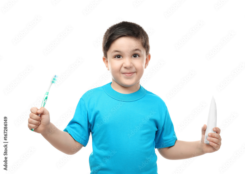Cute boy with toothbrush and paste on white background. Teeth cleaning concept Cute boy with toothbrush and paste on white background. Teeth cleaning concept