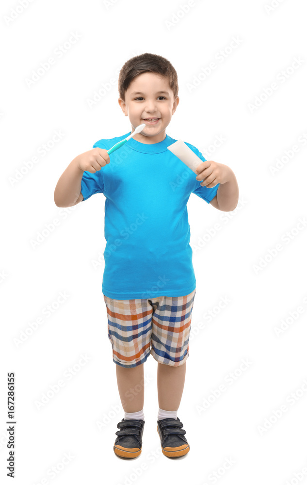 Cute boy with toothbrush and paste on white background. Teeth cleaning concept Cute boy with toothbrush and paste on white background. Teeth cleaning concept