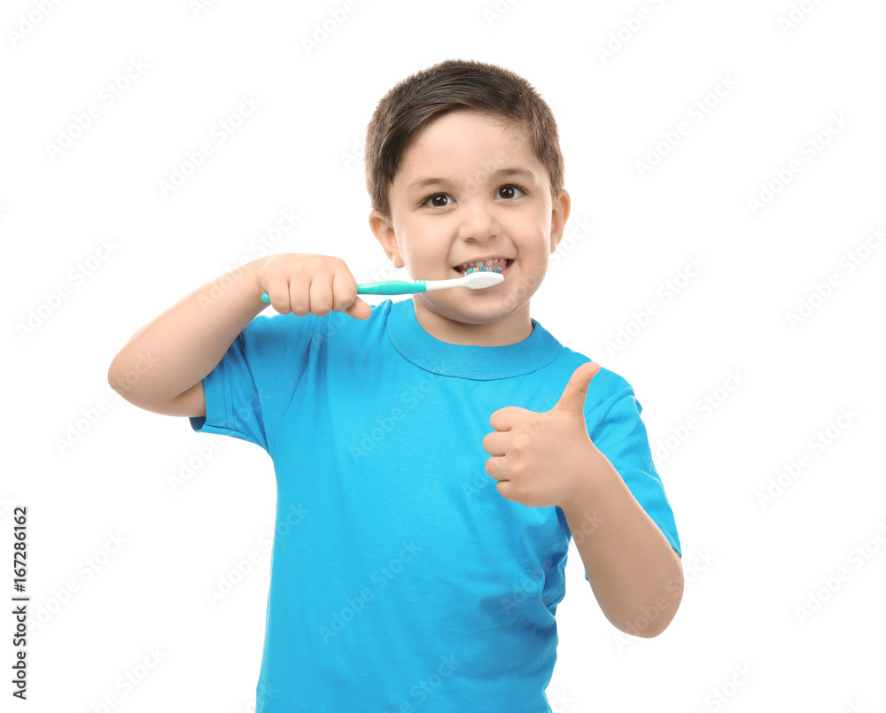 Cute little boy cleaning teeth on white background Cute little boy cleaning teeth on white background