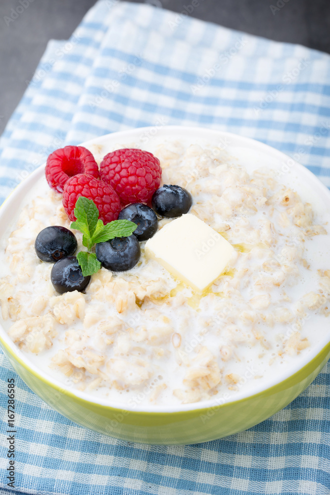 Oatmeal porridge in bowl with berries raspberries and blackberries. Oatmeal porridge in bowl with berries raspberries and blackberries.
