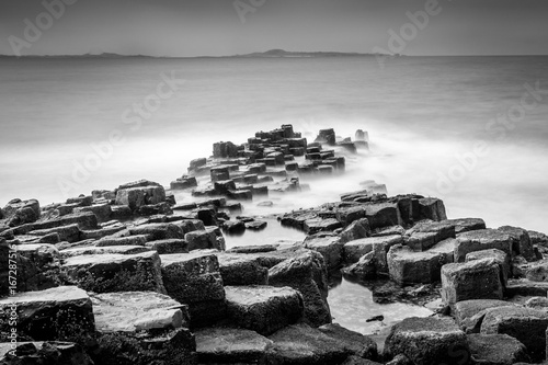 Long exposure seascape of basalt columns on the island of Staffa in the Inner Hebrides, Scotland