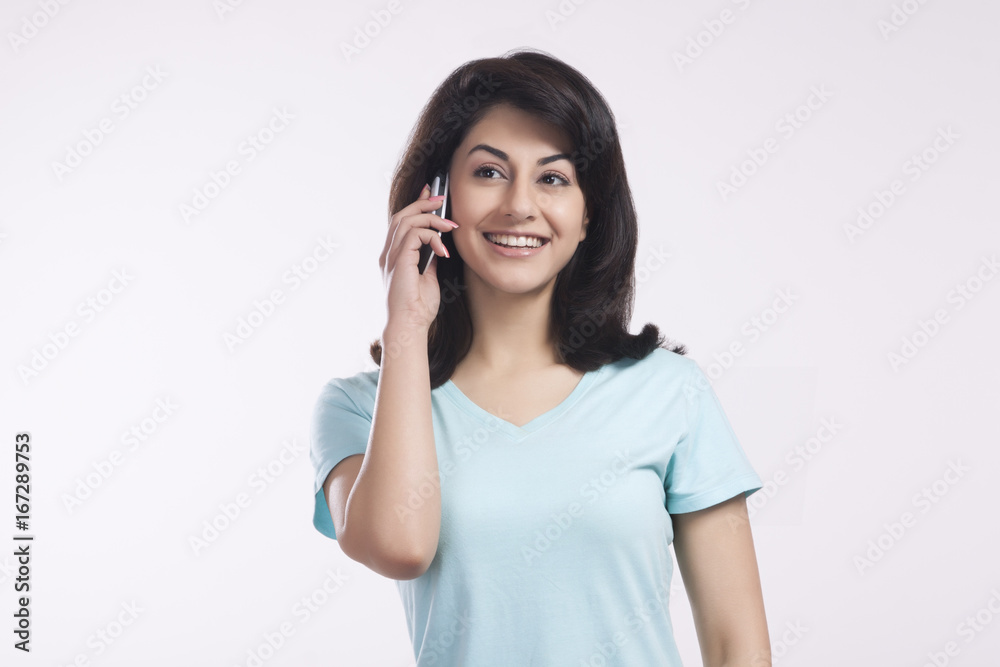 Woman talking on a mobile phone Woman talking on a mobile phone