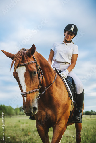 Girl jockey riding a horse