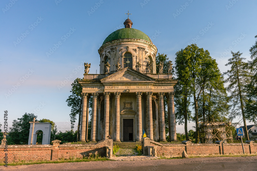 Baroque Roman Catholic church of St. Joseph in Pidhirtsi. Pidhirtsi village is located in Lviv province, Western Ukraine. Summer sunset light.