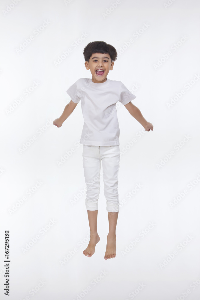 Portrait of boy jumping in the air Portrait of boy jumping in the air