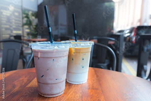 Iced Mocha and Iced Latte coffee drinks in clear plastic cups with straws.
