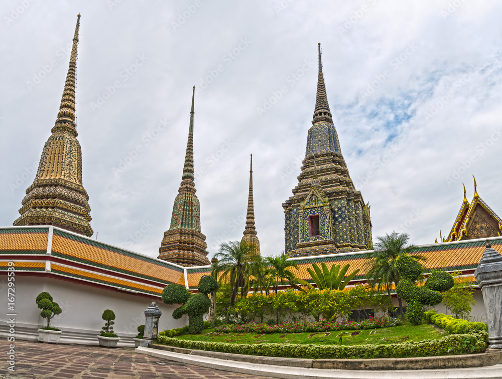 Low down view of Pagodas at Wat Pho temple, Bangkok.