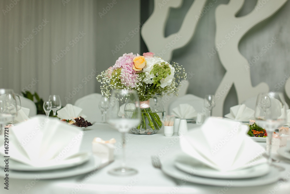 The bride's bouquet at the wedding table. The bride's bouquet at the wedding table.