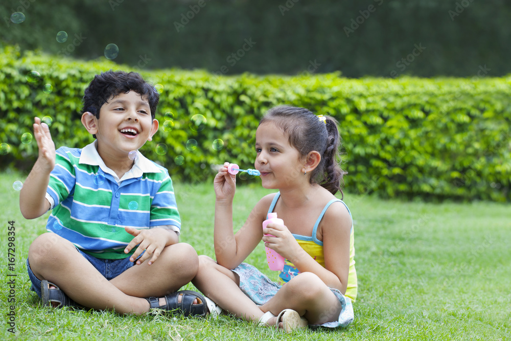 Children playing with bubbles Children playing with bubbles