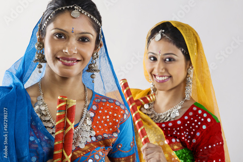 Gujarati women with dandiya sticks 
