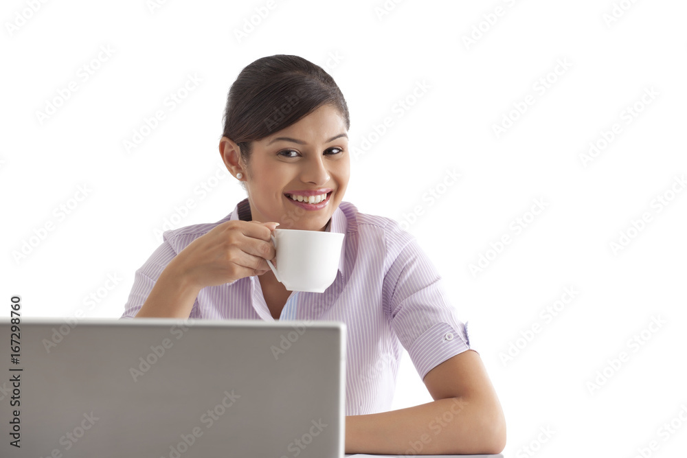 Portrait of female executive having coffee Portrait of female executive having coffee