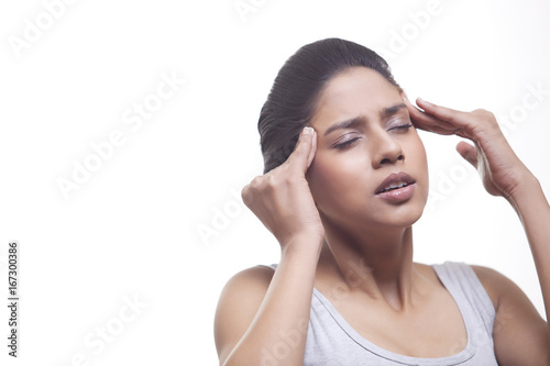 Wallpaper Mural Close-up of young woman suffering from headache isolated over white background  Torontodigital.ca