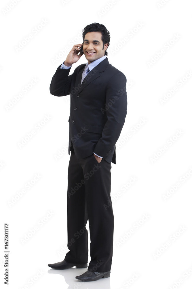 Portrait of businessman talking on a mobile phone 