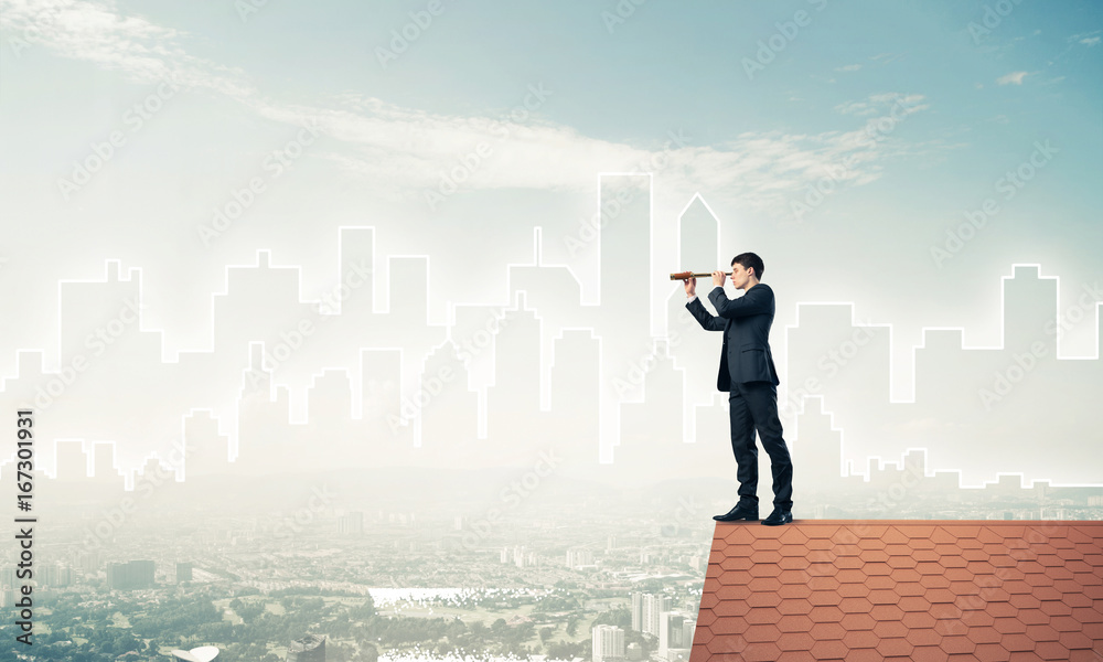 Engineer man standing on roof and looking in spyglass. Mixed med Engineer man standing on roof and looking in spyglass. Mixed med