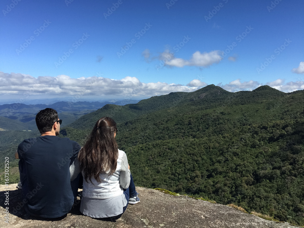 Couple at the top of  a mountain in  Monte Verde, Minas Gerais, Brazil.