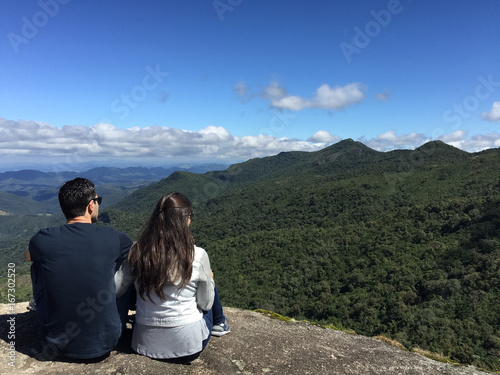 Couple at the top of a mountain in Monte Verde, Minas Gerais, Brazil.