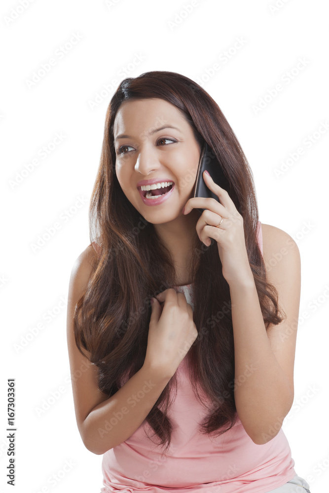 Young woman talking on a mobile phone Young woman talking on a mobile phone