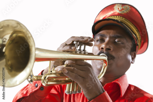 Close-up of bandmaster playing on a trumpet photo