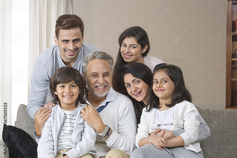 Portrait of smiling multi-generation family on sofa Portrait of smiling multi-generation family on sofa