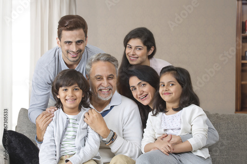 Portrait of smiling multi-generation family on sofa