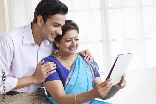 Mother and son reading a greeting card