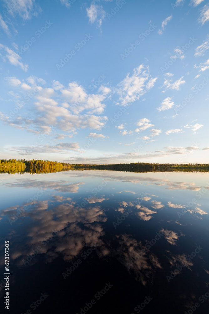 Fototapeta premium Still lake perfect reflection of sky and clouds