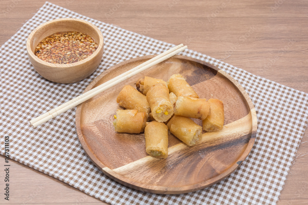 Fried Spring Roll on wooden plate with sauce Fried Spring Roll on wooden plate with sauce