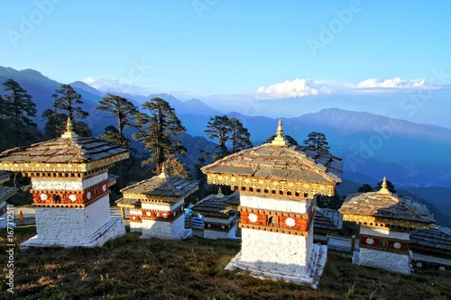 The 108 chortens (stupas) is the memorial in honour of the Bhutanese soldiers with layer of mountains at  Dochula Pass on the road from Thimphu to Punaka, Bhutan