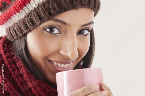 Portrait of young woman drinking tea 