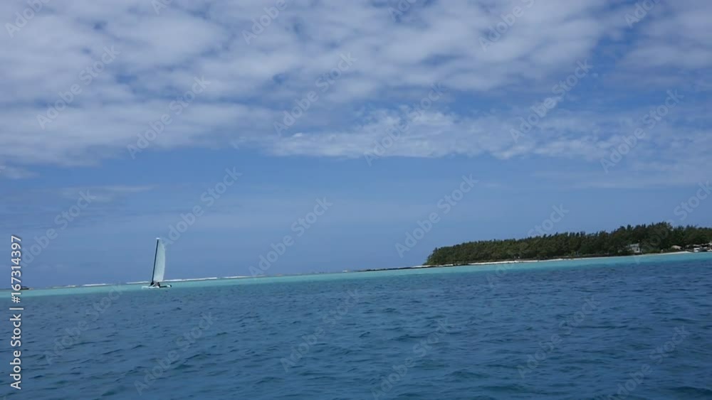 Sailboat off coat of Mauritius Beach, slow motion Sailboat off coat of Mauritius Beach, slow motion