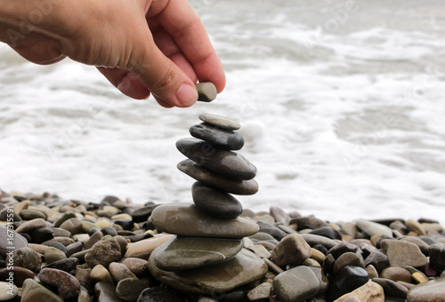 Zen stones balance stack on a seashore