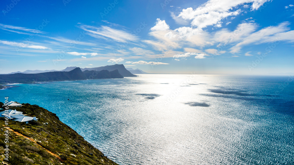 Sun reflecting of the waters of False Bay with Swartkopberg near Simons Town seen from Cape Point at the southern tip of the Cape Peninsula in South Africa