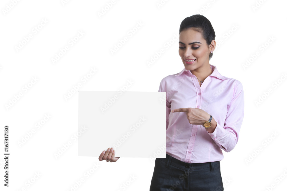 Young businesswoman pointing at black card over white background Young businesswoman pointing at black card over white background