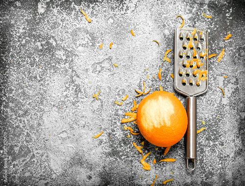 Orange zest with a grater .