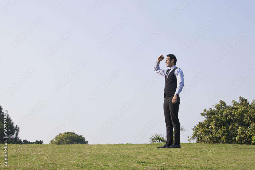 Businessman looking at something , INDIA , DELHI