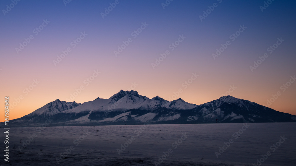 Winter panorama of High Tatras mountains at sunset, Slovakia, Europe.