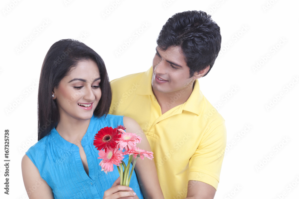 Man giving flowers to his girl friend