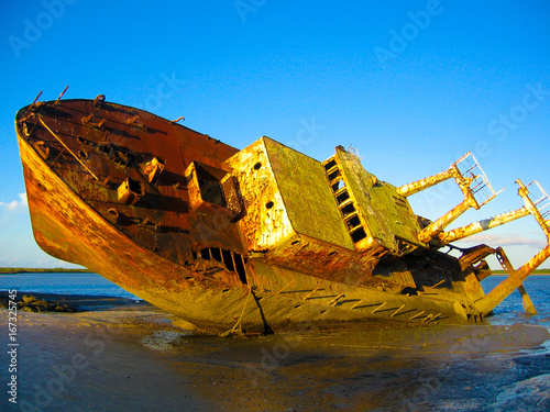 An old grounded shipwreck on a beach in Mozambique