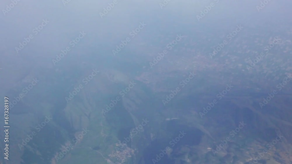 View from the airplane window. Flight over Italy View from the airplane window. Flight over Italy