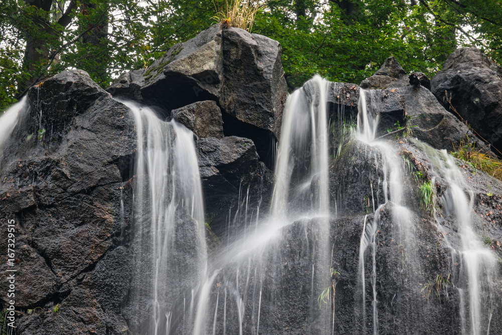 Fototapeta premium The waterfall on mountains in Harz, Germany.