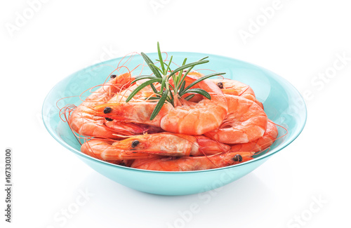 Fresh cooked shrimp on a plate isolated on white background.