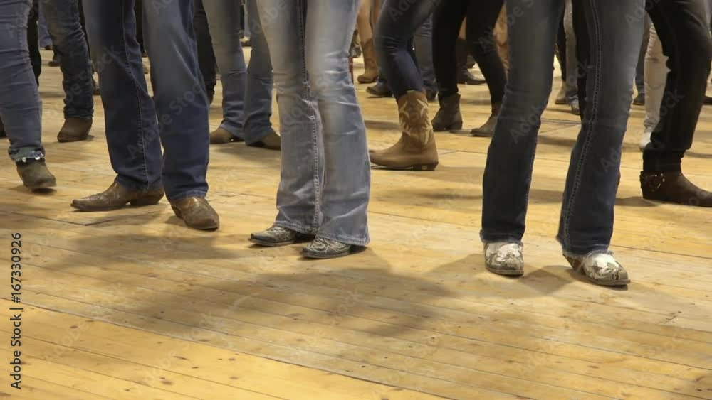 People dancing bluegrass music, line dance at a folk event, cowboy USA style. Cowboy stepping choreography American horse festival. Tradition jeans boots and flag