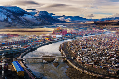 Landscape View of the Yarchen Gar Monastery with many shacks for monks in Garze Tibetan,Sichuan,China. There is The Giant Monasteries of Kham &the largest concentration of nuns and monks in the world.