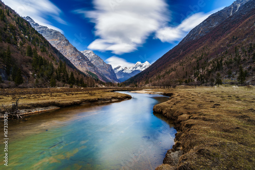 Landscape View stream and snow of Mountain in Siguniang National Park, Sichuan, China 