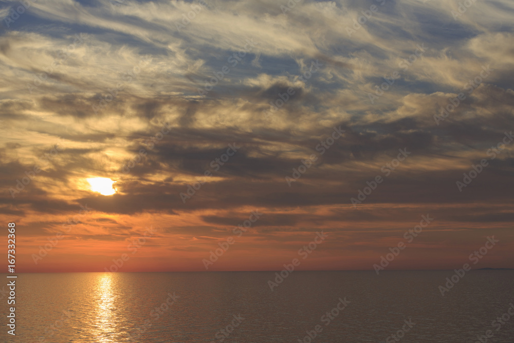 Sky and sea in the sunset, Beautiful colorful sunset with reflection, Dramatic sky background