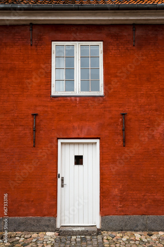 White Entry Door and Window in Red Brick Building  Close Up  Exterior  Europe