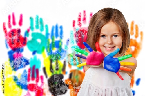 Child with painted hand.